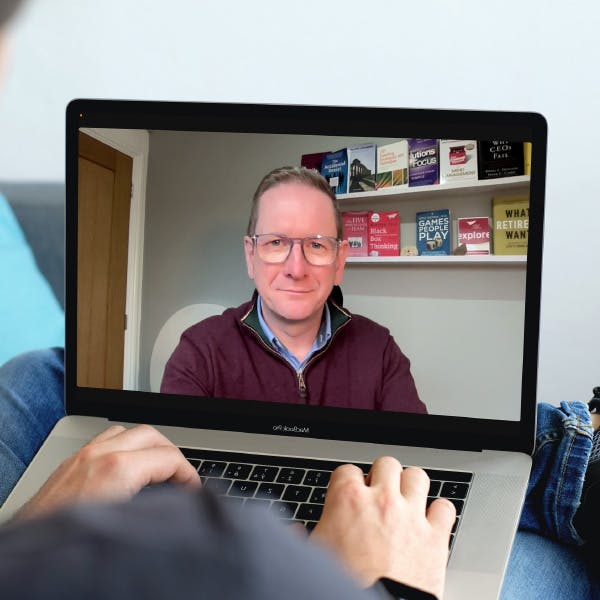 Dyfrig Jenkins on a laptop screen providing a virtual coaching session.